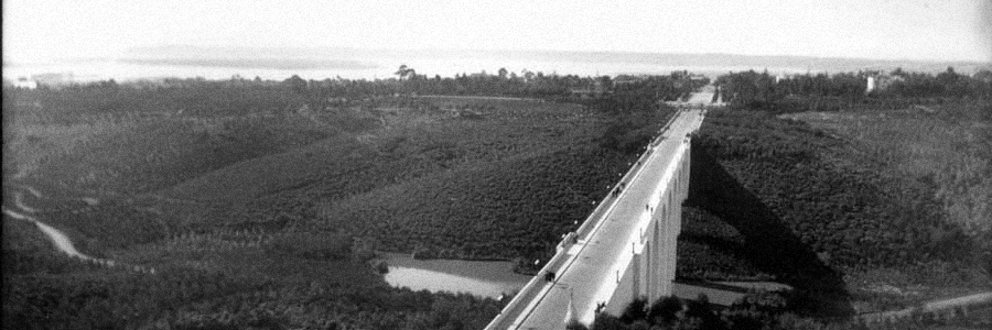 A vintage, black and white aerial photo of the Cabrillo Bridge.