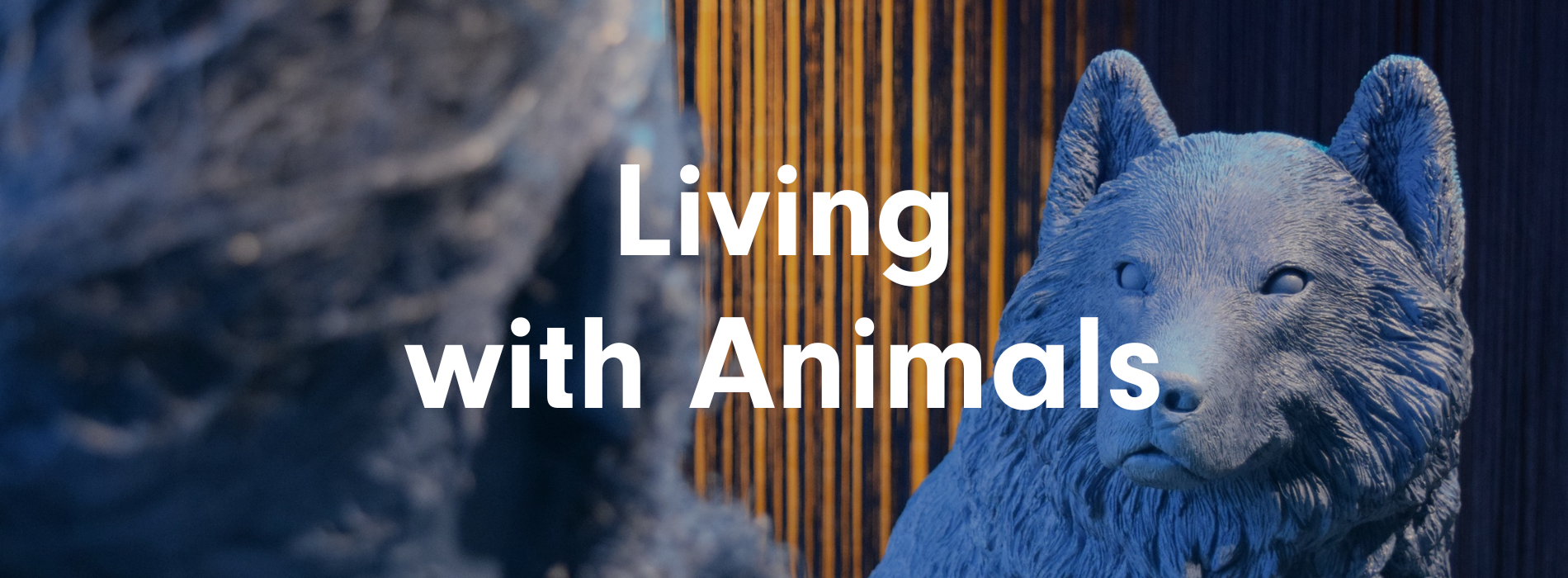A blue wolf replica stares at a blue Homo sapien replica. White text overlayed reads, "Living with Animals".